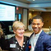 Lavar Green-Jackson smiling with donors at Scholarship Dinner 2019